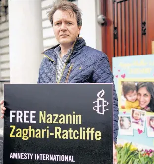  ??  ?? Richard Ratcliffe, husband of British-Iranian dual national Nazanin Zaghari-Ratcliffe, poses for a photograph after delivering a Mother’s Day card and flowers to the Iranian Embassy in London, England, March 31, 2019.