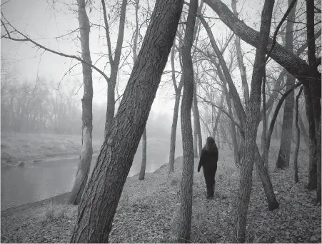  ??  ?? Sex-abuse survivor Miykhaela, not her real name, stands beside the La Salle River just outside Winnipeg.