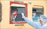  ??  ?? Health workers scan migrants on a Shramik train from Kerala after it arrived at Patna, on May 4.