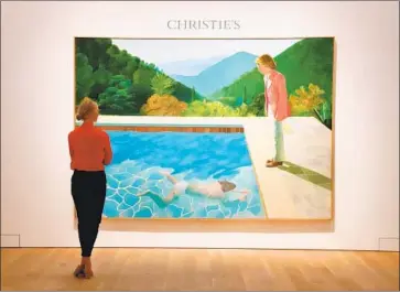  ?? Timothy A. Clary AFP/Getty Images ?? HOCKNEY’S painting is emblematic of his work in many ways, yet the setting is France, not California.