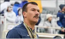  ?? PHOTO COURTESY OF MATTHEW SNIEGOWSKI - ONWARD STATE ?? Former quarterbac­k and student assistant coach Jake Zembiec has become a popular figure on the Penn State sideline because of his mustache and chains.