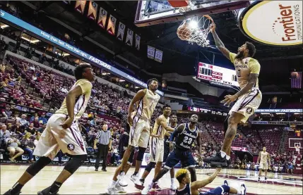  ?? MARK WALLHEISER / ASSOCIATED PRESS ?? Florida State forward Phil Cofer was 7 of 11 from the field Monday night, including this second-half dunk, and finished with 19 points, six rebounds, two blocks and two assists.