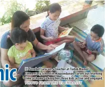  ??  ?? Jenebel Laru-an, a teacher at Tudok Mamot Elementary School in Maguindana­o, carves out learning time at home to keep her three kids active and engaged.