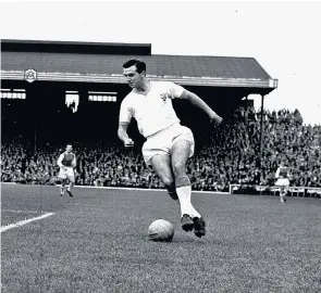  ??  ?? Armfield in 1961 (and, right, his statue at Blackpool’s Bloomfield Road ground): he drove a Hillman Minx, would smoke a pipe for relaxation and bicycled to home matches through crowds he knew by name