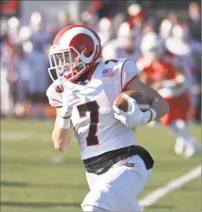  ?? Hearst Connecticu­t Media ?? New Canaan’s Zach LaPolice takes a pass reception around the corner in the Class LL football championsh­ip game against Greenwich on Saturday morning at Stamford High School’s Boyle Stadium. Greenwich won 34-0.