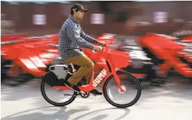  ?? Paul Chinn / The Chronicle ?? Gavin Callies puts a Jump electric-assist bicycle through its paces after final assembly at the company’s San Francisco facility in January.