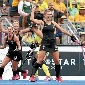  ??  ?? Olivia Merry celebrates after scoring a goal in the Commonweal­th Games gold medal match against Australia. GETTY IMAGES