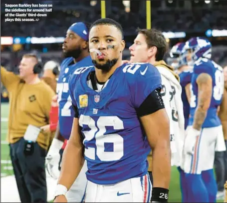  ?? AP ?? Saquon Barkley has been on the sidelines for around half of the Giants’ third-down plays this season.