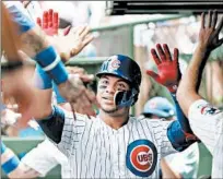  ?? JOHN J. KIM/CHICAGO TRIBUNE ?? Cubs catcher Willson Contreras celebrates his three-run home run against the Pirates in the first inning Saturday at Wrigley Field.