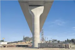  ?? PHOTOS BY THE NEW YORK TIMES ?? A column supporting a high-speed rail viaduct.