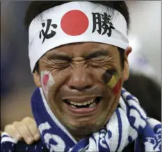  ??  ?? A Japan supporters cries after losing the round of 16 match between Belgium and Japan at the 2018 soccer World Cup in the Rostov Arena, in Rostov-onDon, Russia, on Monday. AP PHOTO/PETR DAVID JOSEK