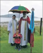  ?? 01_B22FOTS01_22 ?? Father Simon Mackenzie, the Reverend Beki Cansdale and young supporter Oliver Reid at last year’s Festival of the Sea at Lamlash.