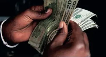  ?? | Reuters ?? ZIMBABWE’S new monetary measures include hiking the tax for foreign currency withdrawal from ATMs from 5 cents to 2 percent.