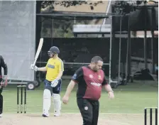  ??  ?? Whitburn batsman James Thomspon raises his bat after reaching his 50