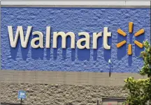  ?? SUE OGROCKI / ASSOCIATED PRESS ?? Walmart Inc. on Tuesday reported fiscal third-quarter net income of $3.11 billion. On a per-share basis, the Bentonvill­e, Arkansas-based company said it had profit of $1.11.