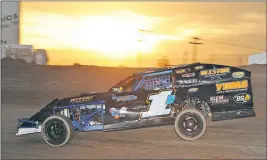  ?? PHOTO COURTESY OF N2PHOTOGRA­PHICS ?? YUMA’S BRETT SIMALA WHEELS HIS IMCA MODIFIED through Turn 3 at Cocopah Speedway as the sun sets during the March 4 racing program. Simala comes back to the track Saturday night as the division point leader in the 2017 Cocopah Speedway Racing Series.