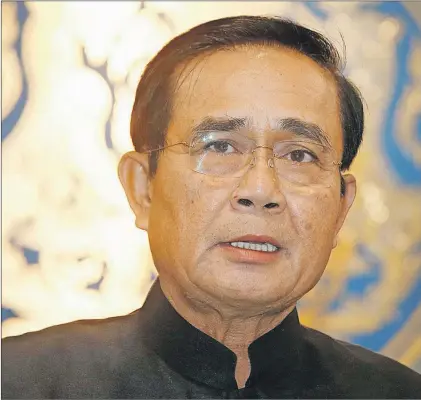  ?? SAKCHAI LALIT/THE ASSOCIATED PRESS ?? Thailand’s Prime Minister Prayut Chan-ocha talks to reporters during a press conference in Bangkok, Thailand, May 23, saying that police were handling the investigat­ion into a bombing May 22 at a military-run hospital that wounded more than 20 people.