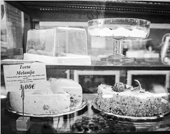  ?? LAURA BOUSHNAK NYT ?? At a café in Sevnica, Slovenia, where Melania Trump spent her childhood, a cake is named Melania. Her fame is useful and many are cashing in on it, but the lovely, ancient town has much else to offer, say locals.