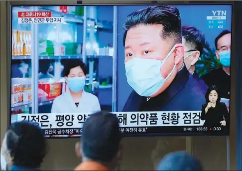  ?? (File Photo/AP/Lee Jin-man) ?? People watch a news program with an image of North Korean leader Kim Jong Un on Monday at a train station in Seoul, South Korea.