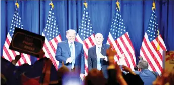  ?? — AFP photo ?? Delegates cheer as Trump (left) and Pence stand on stage during the first day of the Republican National Convention in Charlotte, North Carolina.