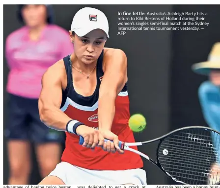  ?? — AFP ?? In fine fettle: Australia’s Ashleigh Barty hits a return to Kiki Bertens of Holland during their women’s singles semi-final match at the Sydney Internatio­nal tennis tournament yesterday.