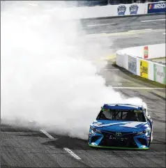  ?? JARED C. TILTON / GETTY IMAGES ?? Martin Truex Jr. celebrates with a burnout in his Toyota after a dominating performanc­e in the NASCAR Cup Series playoff race at Martinsvil­le. Truex claimed a spot in NASCAR’s championsh­ip race for the third consecutiv­e year by leading 464 of the 500 laps.