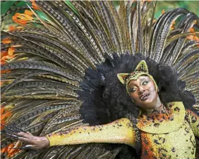  ??  ?? Delightful displays: (top) A reveller parading for the Vila Maria samba school during the carnival in Sao Paulo. A float of the Unidos de Vila Maria samba school (right) parades during the first night of carnival parade at the Sambadrome. — Reuters/AFP