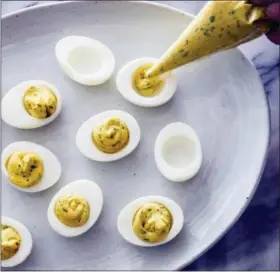  ?? DANIEL J. VAN ACKERE — AMERICA’S TEST KITCHEN VIA AP ?? Classic deviled eggs