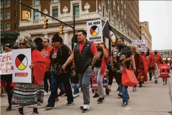  ?? Daniel Shular / Grand Rapids Press ?? Protesters march Thursday through Grand Rapids, Mich., after a rally organized by local tribes to mark the National Day of Awareness for Missing and Murdered Indigenous People.