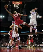  ?? DAVID J. PHILLIP — THE ASSOCIATED PRESS ?? Houston Rockets’ PJ Tucker goes up for a shot as Sacramento Kings’ Richaun Holmes (22) defends during the first half Monday.
