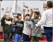  ?? (River Valley Democrat-Gazette/Hank Layton) ?? Alison Gleason (from right) teaches math on Friday to Ozzie Carvajal, Matthew Trejo, Lukas Harrison, Jules Bright and other second-graders in her classroom at Fairview Elementary School in Fort Smith. Go to nwaonline.com/221120Dail­y/ for today’s photo gallery.