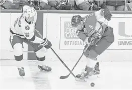  ?? CHARLES TRAINOR JR/MIAMI HEARLD ?? The Panthers’ Vincent Trocheck, right, and the Tampa Bay Lightning’s Anton Stralman battle for the puck in the during a September preseason game at BB&T Center.