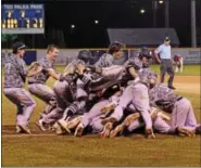  ?? AUSTIN HERTZOG - DIGITAL FIRST MEDIA ?? Norchester players pile on to one another after winning the Berks County League championsh­ip over Boyertown Monday.