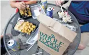  ??  ?? Analysts are skeptical of the idea that Amazon plans big changes that would hurt Whole Foods’ ambiance.
