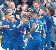 ??  ?? Pulisic, second left, celebrates with Blues players