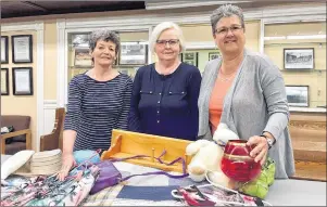  ?? SUBMITTED PHOTO ?? Heather Holdway, left, Gail Burt, centre, and Lynn Trowsdale display a few of the many items that will be on sale at the Zion Presbyteri­an Church annual spring sale June 1 and 2. The church is located at 135 Prince St. in Charlottet­own at the corner of...