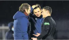  ??  ?? In the ear
Jambos boss Neilson with ref Steven McLean