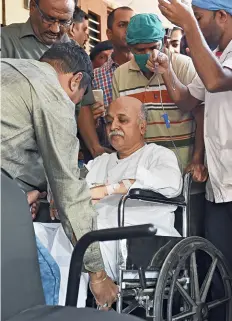 ??  ?? MIFFED Togadia arrives in a wheelchair to address a press conference in Ahmedabad