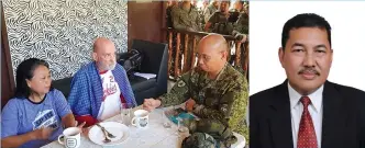  ??  ?? A photo released by the 11th Infantry Division shows British man Allan Arthur and his Filipina wife Welma Hyrons with Major General Corleto Vinluan during their breakfast November 25, 2019 at a military base in Jolo town in Sulu province. On the right is Indonesian Consul General Dicky Fabrian.