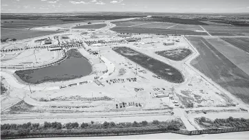  ?? Ivan Pierre Aguirre for the San Antonio Express-News ?? An aerial shot of the facility where the newly formed tent city is located in Tornillo. Legislatio­n is pending to end the separation­s of migrant children and parents, including a late announceme­nt Monday by Texas Republican Sen. Ted Cruz that he would file a bill to double the number of federal judges and require families to be kept together.