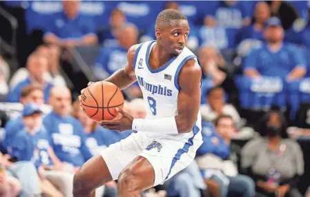  ?? CHRIS DAY/THE COMMERCIAL APPEAL ?? Memphis' David Jones looks to pass against Florida Atlantic University on Feb. 25.