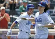  ?? KATHY WILLENS — THE ASSOCIATED PRESS ?? The Mets’ Michael Conforto, left, congratula­tes starting pitcher Jacob deGrom, who hit a home run in the third inning on Sunday.