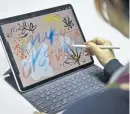  ?? AP ?? WHAT A PRO: Japanese artist Mako Oke uses an Apple Pencil to draw on a new iPad Pro. Apple unveiled several new products yesterday at an event in Brooklyn, N.Y.