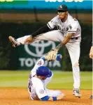  ?? | AP ?? Sox shortstop Tim Anderson avoids sliding Cubs baserunner Ben Zobrist to complete a double play in the third inning.