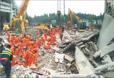  ?? PROVIDED TO CHINA DAILY ?? Rescue workers search for survivors                                                                                                                                    