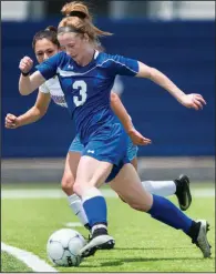  ?? NWA Democrat-Gazette/CHARLIE KAIJO ?? Rogers midfielder Skylurr Patrick drives the ball down the field during the Class 7A girls soccer state tournament semifinal Saturday at Rogers High School. Patrick scored both of Rogers’ goals in a 2-1 victory over Fort Smith Southside.