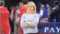  ?? Orlin Wagner / Associated Press ?? Kansas strength coach Andrea Hudy is seen as Kansas warms up for an NCAA basketball game against Cornell in Lawrence, Kan. Hudy was named director of sports performanc­e for UConn women’s basketball on Wednesday.