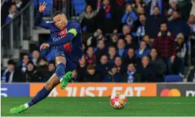  ?? Álvaro Barrientos/AP ?? Kylian Mbappé scores Paris Saint-Germain’s second goal against Real Sociedad. Photograph: