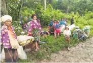  ?? Labram Hkun Awng / Associated Press ?? Civilians displaced by fighting between the military and Kachin guerrillas take shelter near Tanai town.