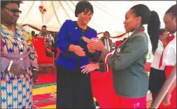  ??  ?? A student gets an award from Justice Gwaunza